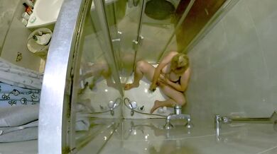Mature cougar jerks off in the shower until her pussy drips