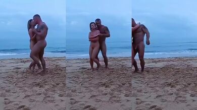 MILF Laura Dante naked dancing on public beach with muscle stud