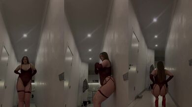 Thick blonde in red sheer bodysuit teases huge natural tits and fat ass hallway POV