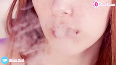 Vaping redhead tease strips naked for you