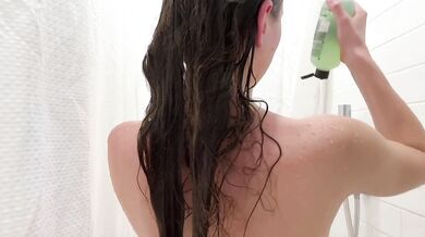 Skinny girl soaks in bubbles then soaps up her shaved pussy raw solo