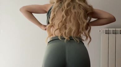 Skinny blonde teases while trying on tight gym outfits for you to choose