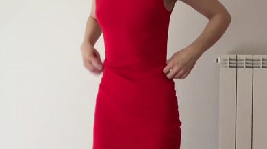 Blonde bombshell in red dress teases and dances in matching heels for date night