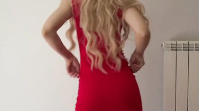 Blonde bombshell in red dress teases and dances in matching heels for date night