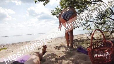 Stranger on a Russian public beach gets her first handjob from a random babe