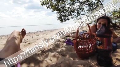 Stranger on a Russian public beach gets her first handjob from a random babe