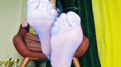 Feet worship in sheer blue stockings her soles on display