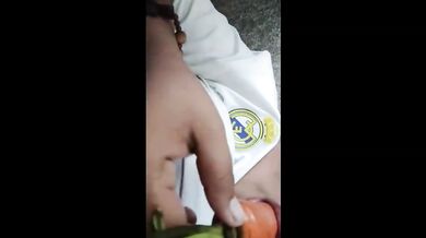 Fat Asian girl stuffs carrot in both holes while alone