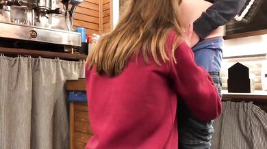 Teen whore gets caught sucking cock under bar counter at work