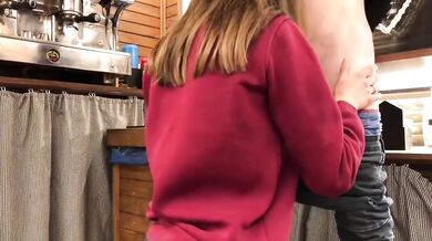 Teen whore gets caught sucking cock under bar counter at work
