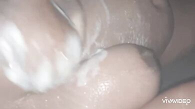 In the shower she gets soaked and gushing