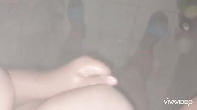 In the shower she gets soaked and gushing