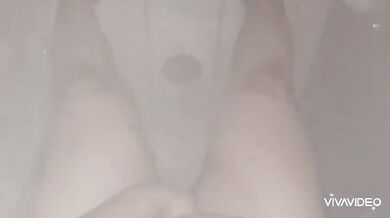 In the shower she gets soaked and gushing