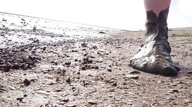 Feet in fine stockings splashing the Wadden Sea Wangerland