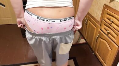 Busty blonde tears veggies while wiggling pink panties in tight white tank