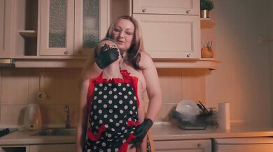 Gloved Stepmom Controls Tiny Stepdaughter With Hand Over Mouth In Apron Kitchen Scene