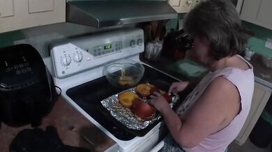 Sexy Mature Granny Bakes Pumpkin Pie In Kitchen