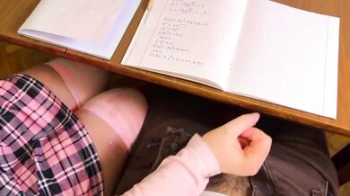 Japanese schoolgirl handjob under table in public classroom cumshot