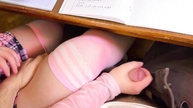 Japanese schoolgirl handjob under table in public classroom cumshot