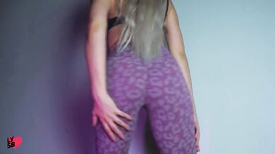 Whore in pink yoga pants dancing and sucking dildo