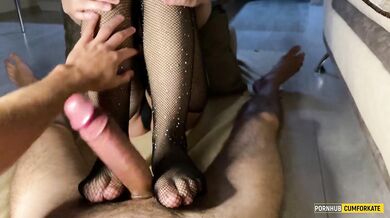 Juicy cumshot from footjob in mesh tights