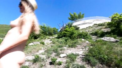 Girl nudist naturist exhibitionist walking in the mountains