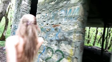 An exhibitionist Girl walks through abandoned buildings