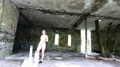 An exhibitionist Girl walks through abandoned buildings