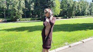Stylish Lady walks naked in park. Public.
