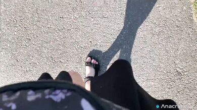 A Girl Walks In Nature In A Skirt And Massages Her Feet