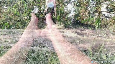 A Girl Walks In Nature In A Skirt And Massages Her Feet