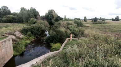 Naked girl on the bridge