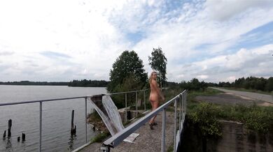 Naked girl on the bridge