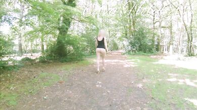Milf in wedges walking bare ass in the forest