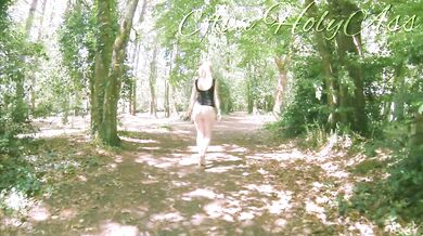 Milf in wedges walking bare ass in the forest