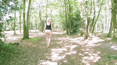 Milf in wedges walking bare ass in the forest
