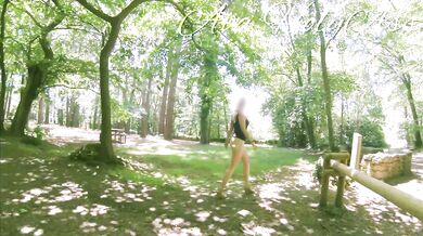 Milf in wedges walking bare ass in the forest