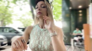 She cum with risky public masturbation in open cafe on the busy street. Transparent top, no panties.