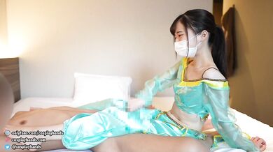 Japanese girl dressed as gives a guy a footjob