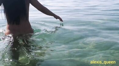 She masturbates on the nudist beach, squirts and then walks naked across the sea in front of the voy
