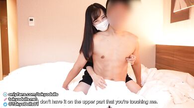 Japanese cute girl wearing Pornhub T-shirt gives a guy a handjob with showing her panties.