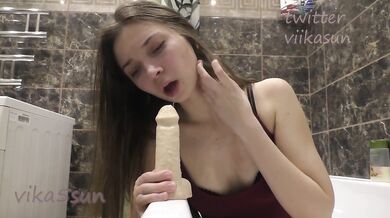 a young slut tries a dildo in the shower