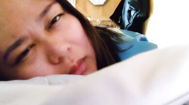 Big breasted Japanese woman masturbates after waking up
