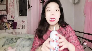 CUTE Asian girl licks CREAM and gets VIBRATOR for Christmas