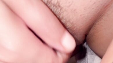 She unabashedly displays her hairy pussy and climaxes from masturbation.