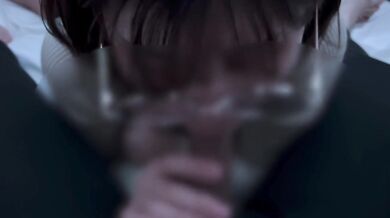 A girl with neat glasses gets ejaculated in the mouth.