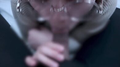 A girl with neat glasses gets ejaculated in the mouth.