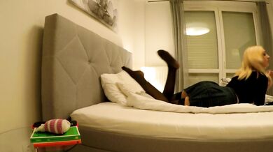 Fantastic Tease of Sofie in Short Uniform Miniskirt and Black Stockings on the Bed Playing with Dick