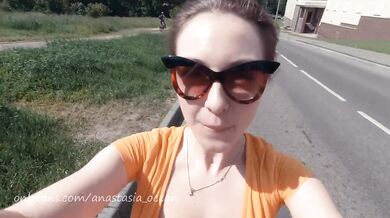 Naked girl on a motorcycle. Topless in the city