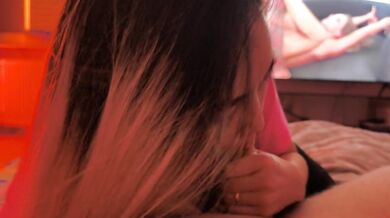 Blowjob while porn on background